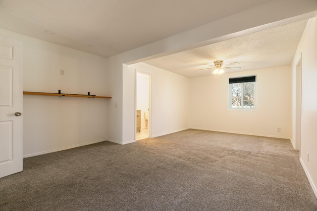 carpeted empty room with a textured ceiling and ceiling fan