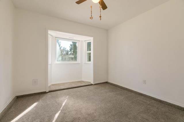 unfurnished room featuring carpet and ceiling fan