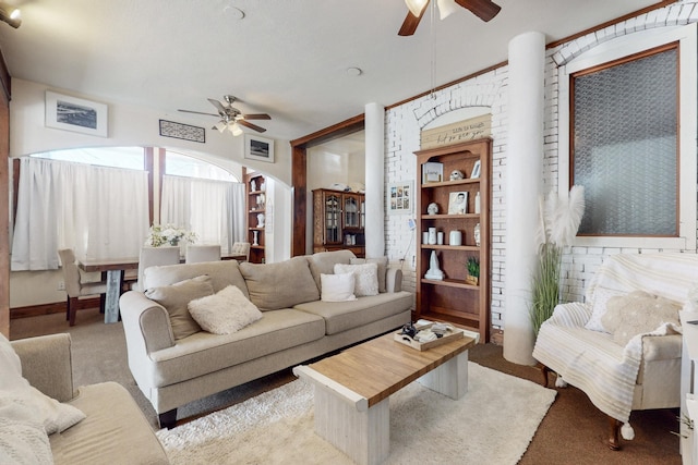 carpeted living room with ceiling fan