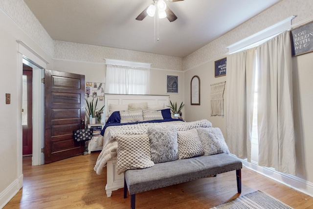 bedroom with ceiling fan and light wood-type flooring