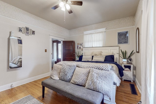 bedroom with wood-type flooring and ceiling fan