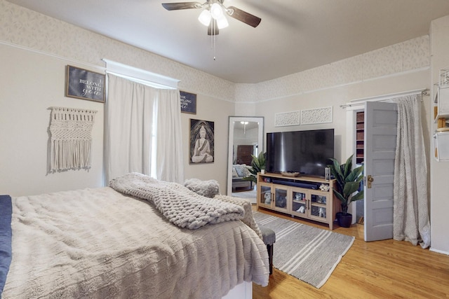 bedroom featuring light hardwood / wood-style floors and ceiling fan