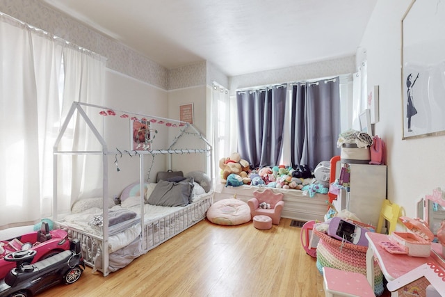 bedroom featuring hardwood / wood-style floors