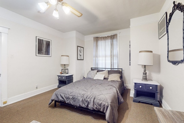 bedroom with dark colored carpet and ceiling fan