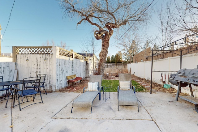 view of patio with a grill