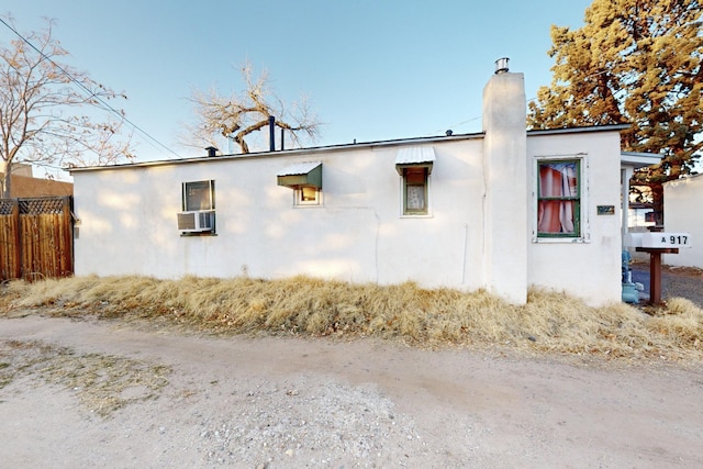 view of side of home with cooling unit