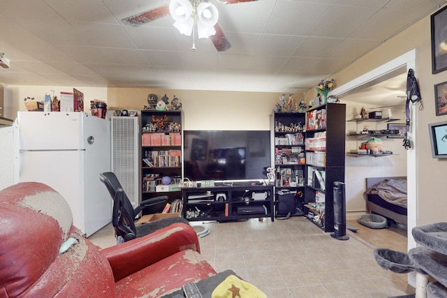 living room with light tile patterned floors and ceiling fan