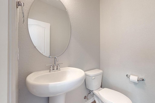 bathroom with sink and toilet