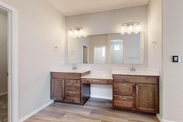 bathroom featuring vanity and hardwood / wood-style floors