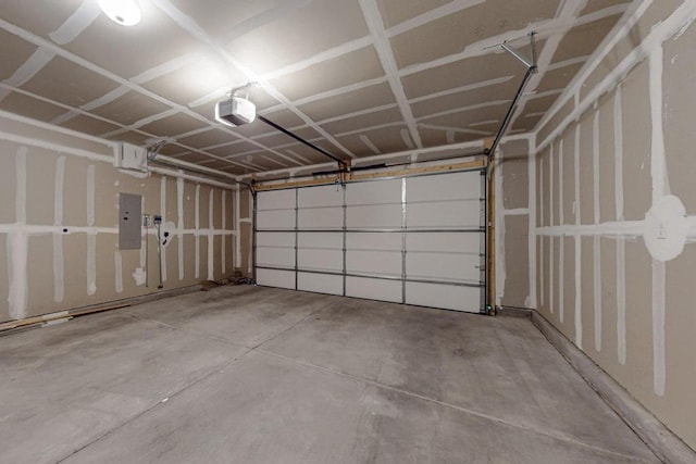 garage featuring a garage door opener and electric panel