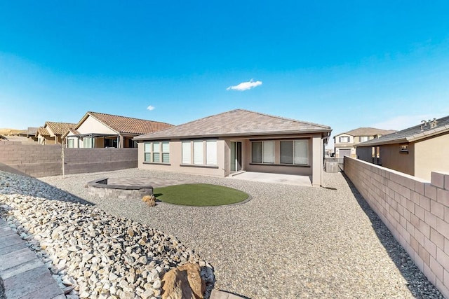 rear view of house with a patio area