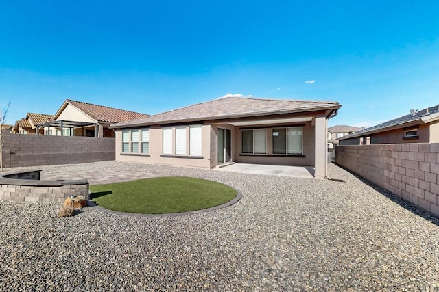 rear view of house featuring a patio