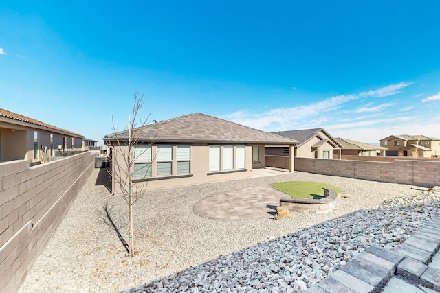 rear view of house featuring a patio