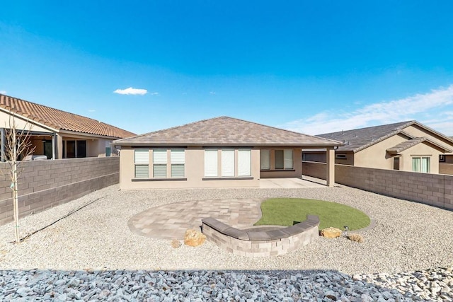 rear view of house featuring a patio area