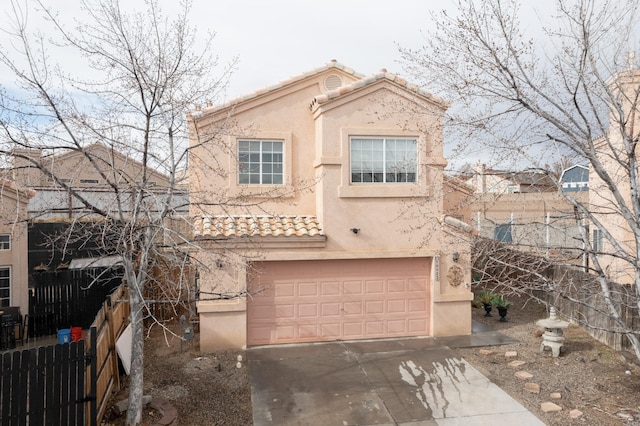 mediterranean / spanish-style home featuring a garage