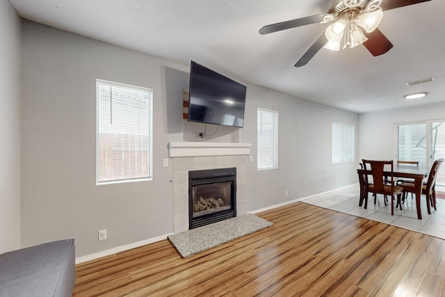 living room featuring plenty of natural light and light wood-type flooring