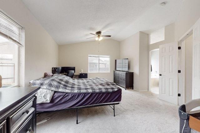 bedroom featuring vaulted ceiling, light carpet, and ceiling fan