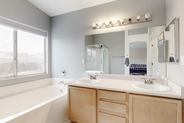 bathroom with vanity and plus walk in shower