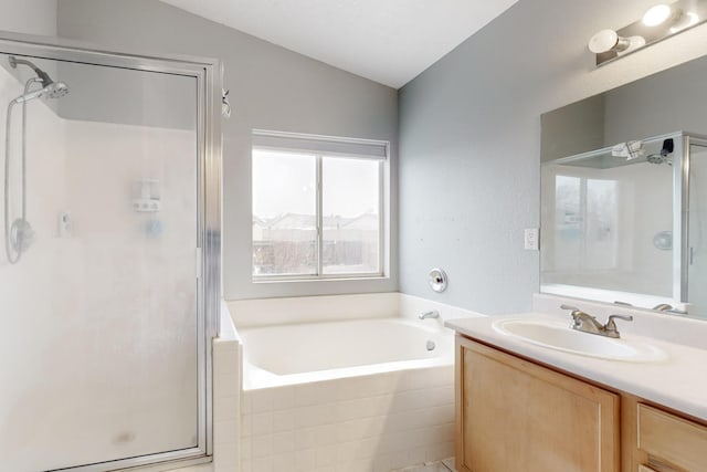 bathroom featuring vanity, lofted ceiling, and plus walk in shower