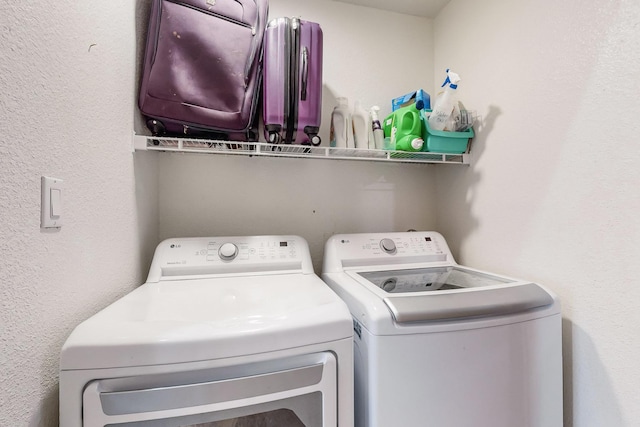 washroom featuring washer and clothes dryer