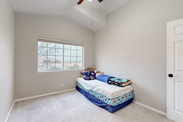 bedroom featuring vaulted ceiling, carpet flooring, and ceiling fan