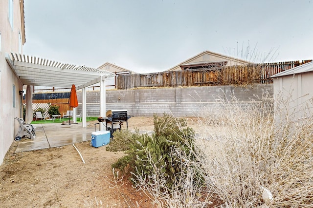 view of yard featuring a pergola and a patio