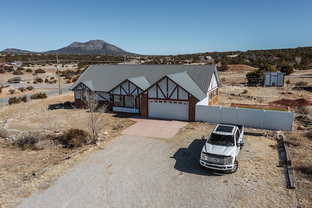 view of front of house featuring a mountain view and a garage