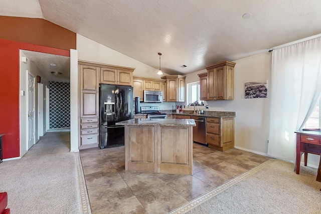 kitchen with a kitchen island, appliances with stainless steel finishes, lofted ceiling, sink, and hanging light fixtures