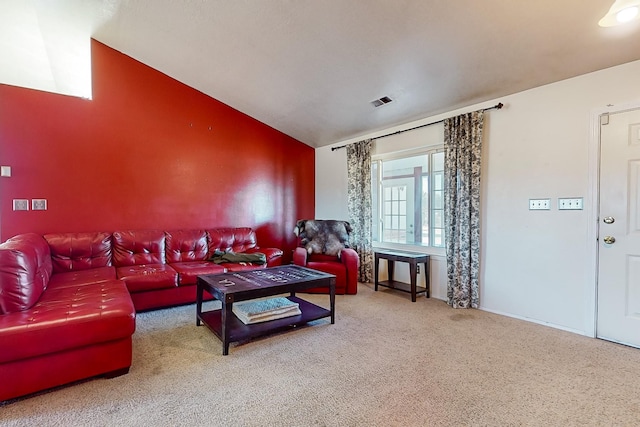 living room with vaulted ceiling and carpet flooring