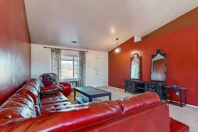 carpeted living room with lofted ceiling