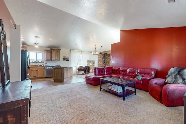 carpeted living room with sink and a textured ceiling