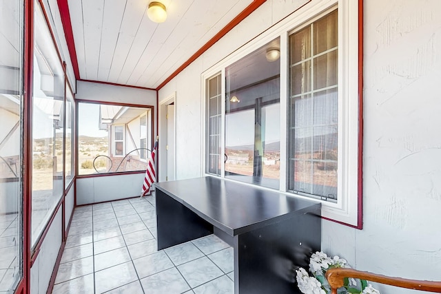 unfurnished sunroom featuring wood ceiling