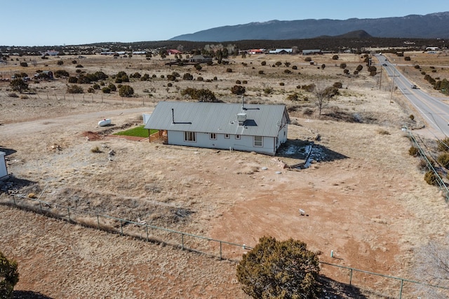 drone / aerial view with a mountain view and a rural view