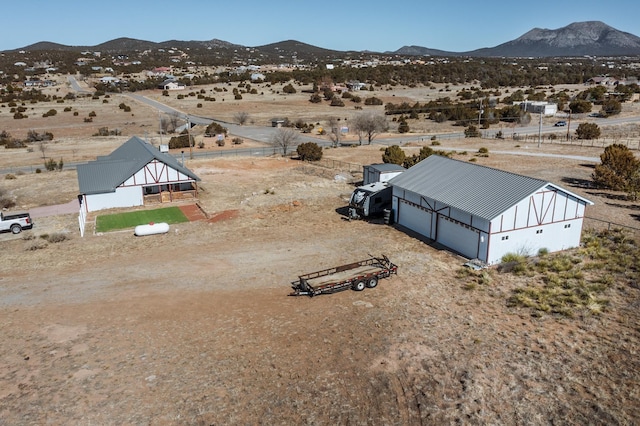 birds eye view of property featuring a mountain view