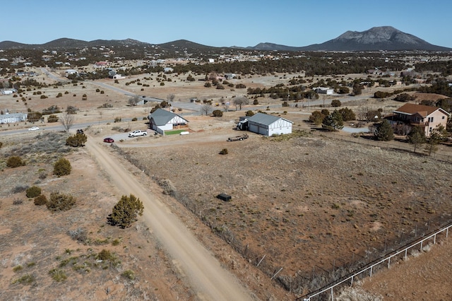 drone / aerial view with a rural view and a mountain view