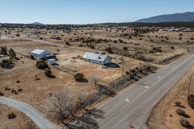 drone / aerial view with a rural view and a mountain view