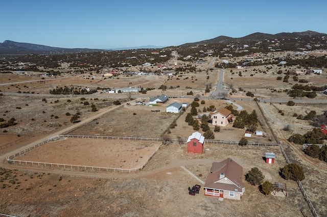 birds eye view of property with a mountain view