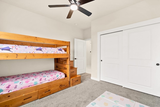 bedroom with carpet, ceiling fan, and a closet