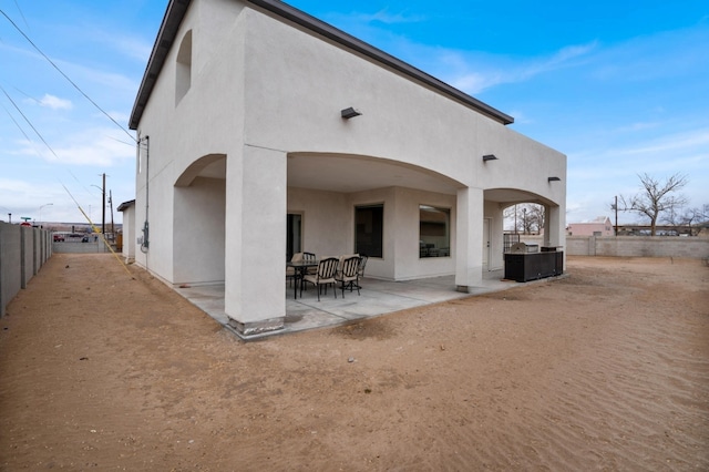 rear view of property featuring a patio area