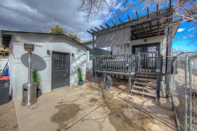 back of property featuring a patio