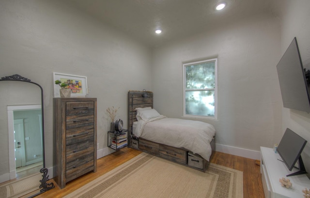 bedroom with light hardwood / wood-style flooring