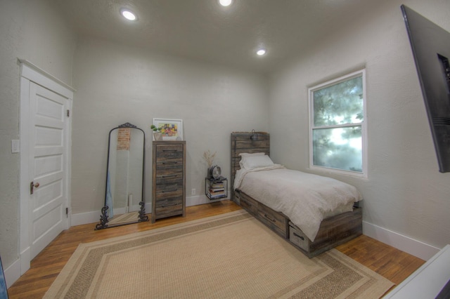 bedroom featuring hardwood / wood-style flooring