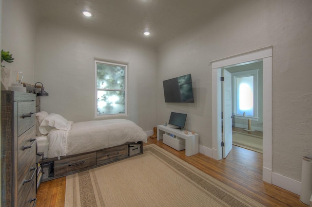 bedroom with wood-type flooring