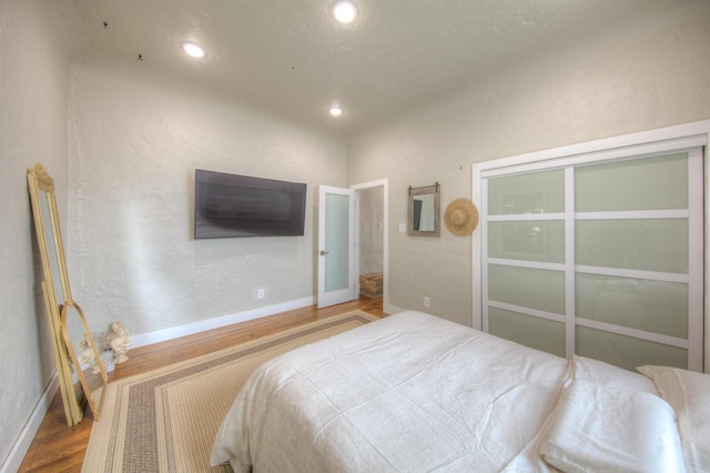 bedroom with wood-type flooring