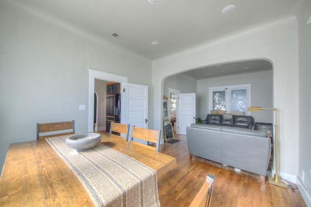 dining space featuring hardwood / wood-style floors