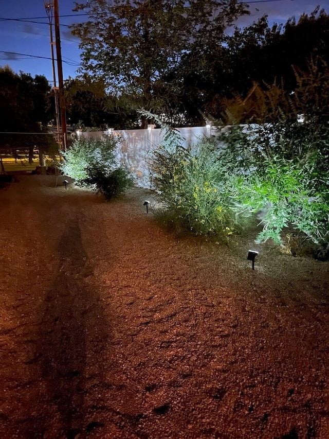 view of yard at dusk