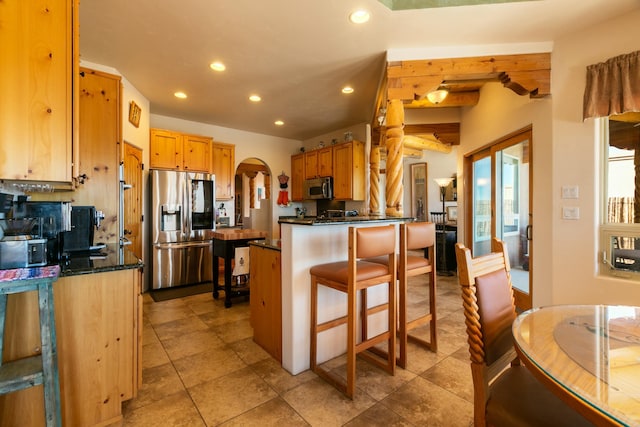 6816 Nagoya Rd NE, Rio Rancho, NM 87144 - kitchen with stainless steel appliances and a kitchen breakfast bar