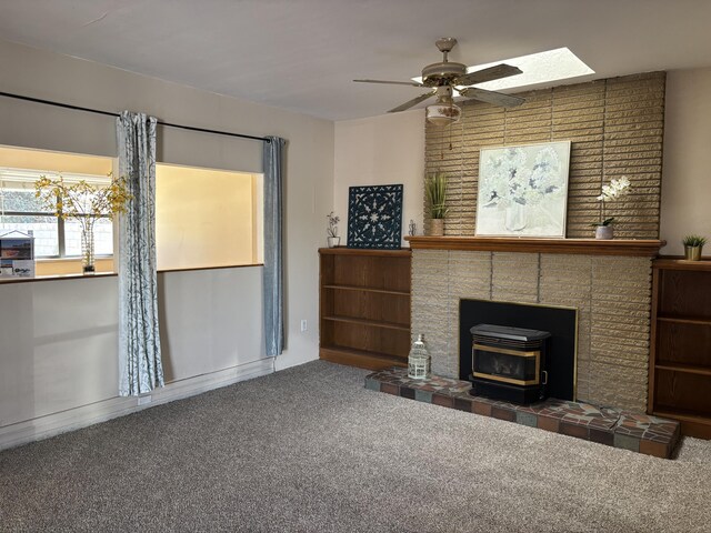 unfurnished living room with carpet floors and ceiling fan