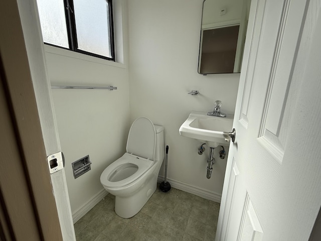 bathroom featuring sink and toilet