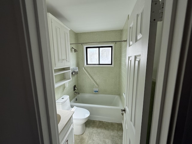 full bathroom with vanity, toilet, and tiled shower / bath combo